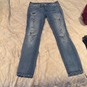 American Eagle, skinny jeans super stretch size 10 distressed light mid blue